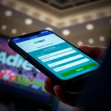 Smartphone screen showcasing the AdiBet app registration form with fields for personal details