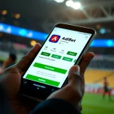 Mobile phone displaying the AdiBet app download page on a digital store platform